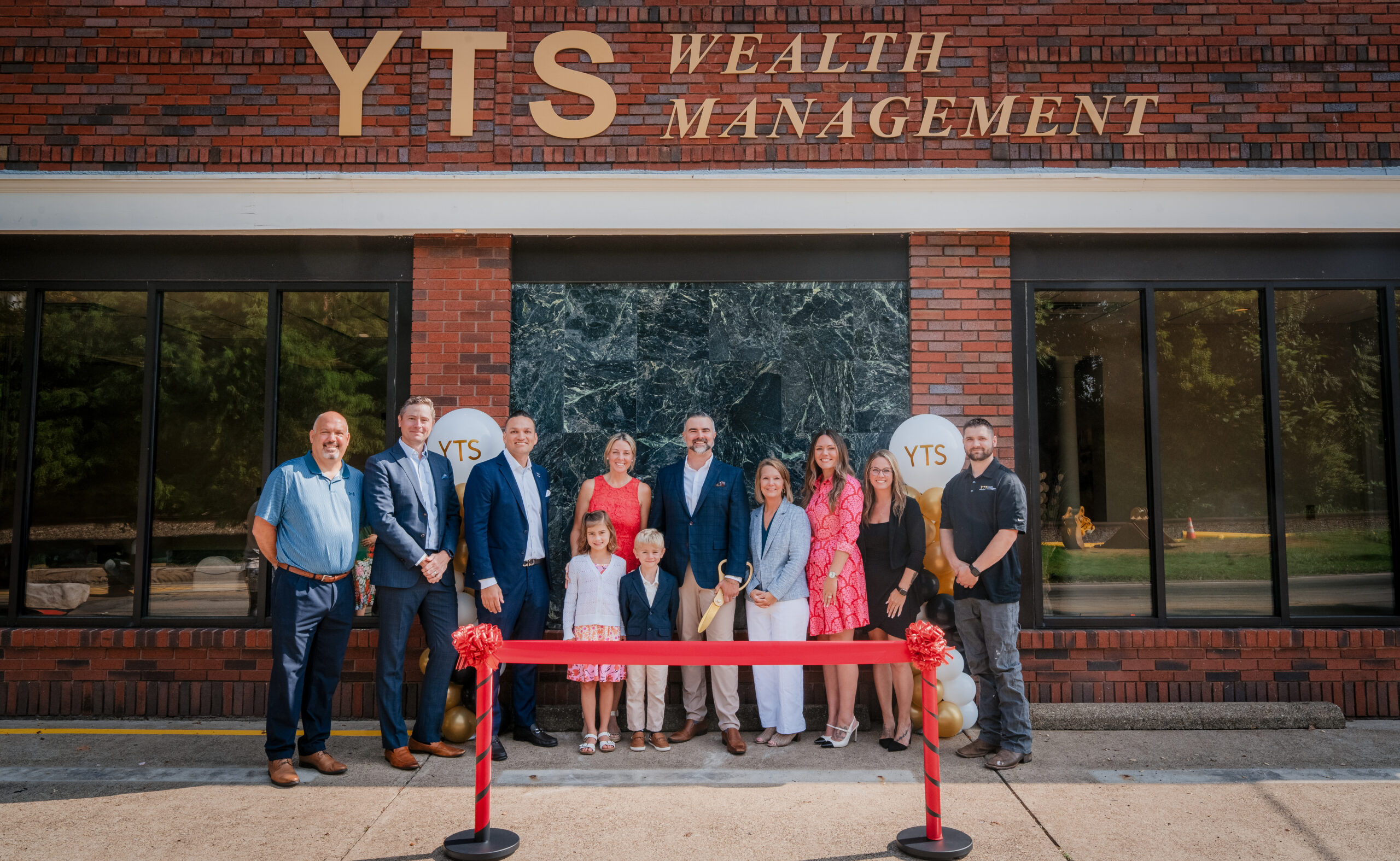 YTS Wealth Management team in front of the building during the Aspinwall Branch Ribbon Cutting