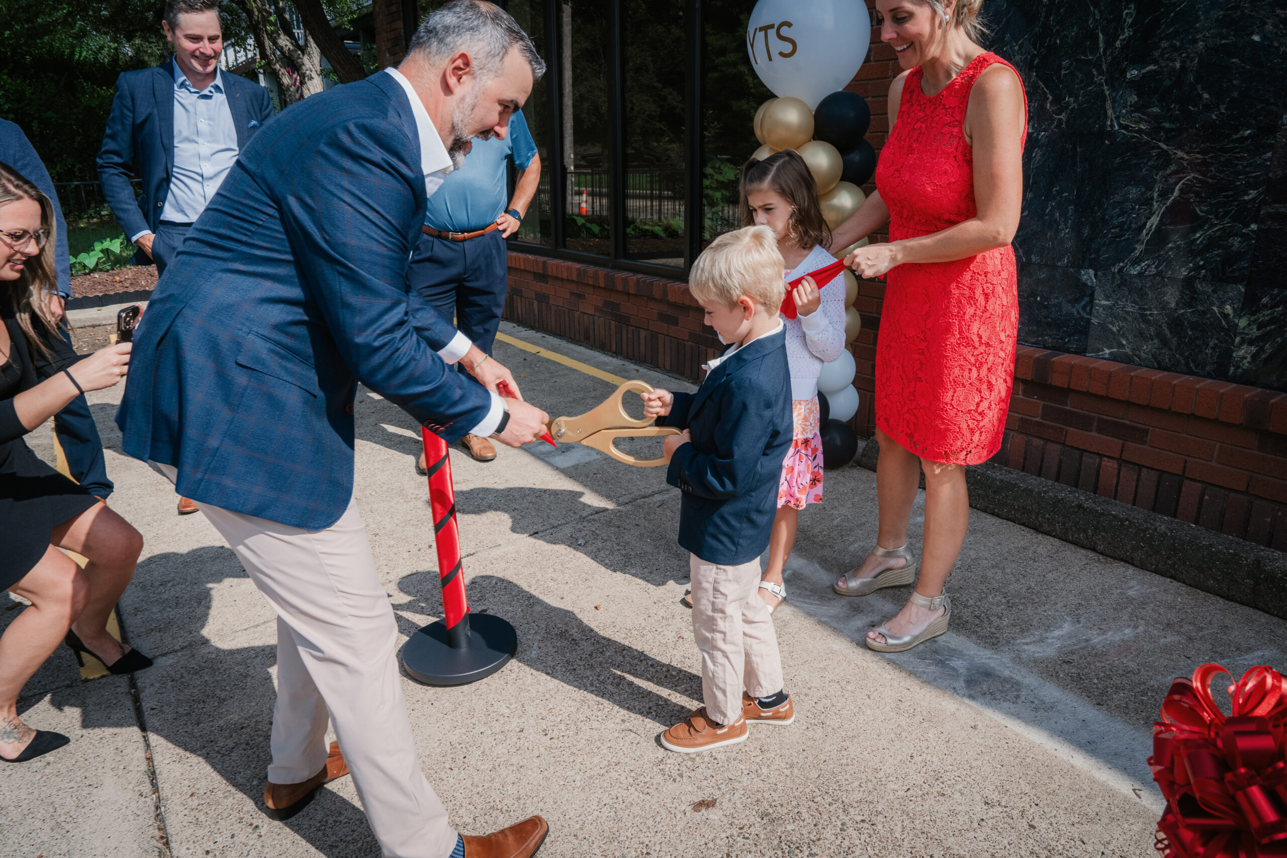 YTS Wealth Management team in front of the building during the Aspinwall Branch Ribbon Cutting